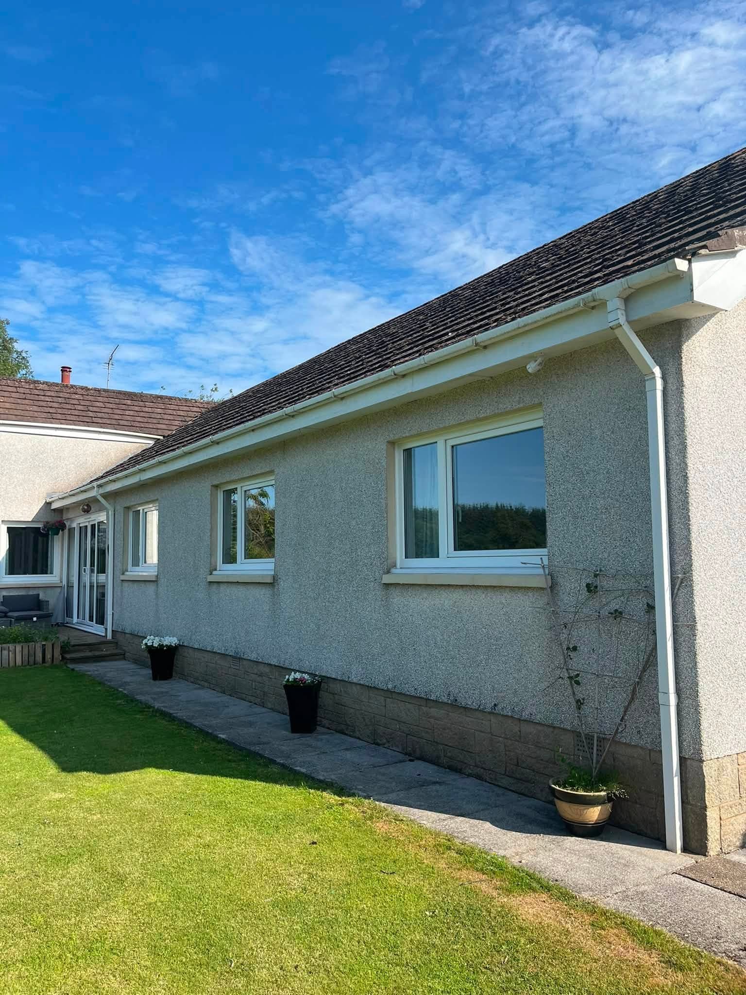 Completed white uPVC fascias and gutter along a bungalow roofline