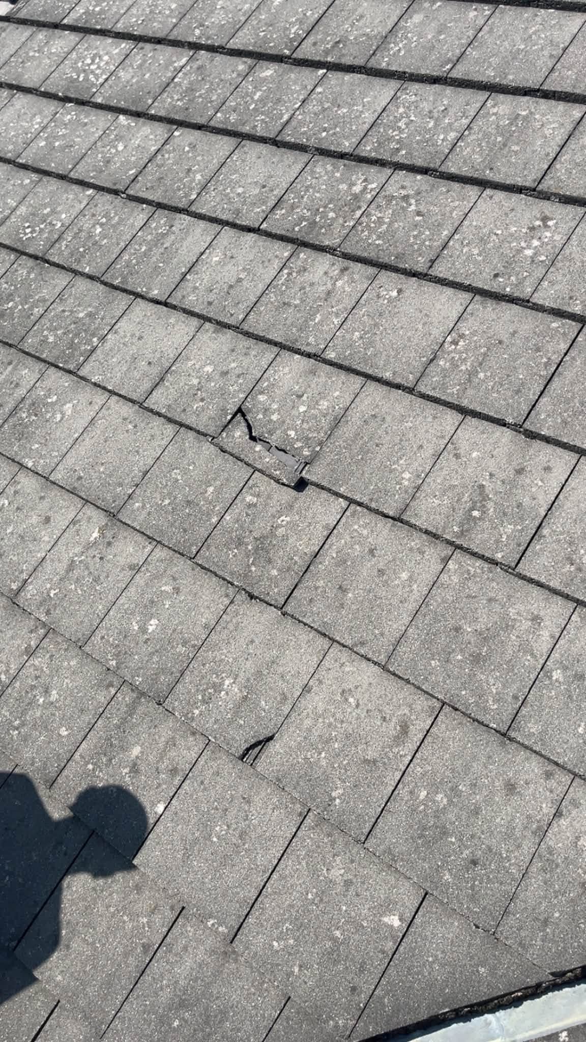Cracked concrete roof tile spotted during inspection