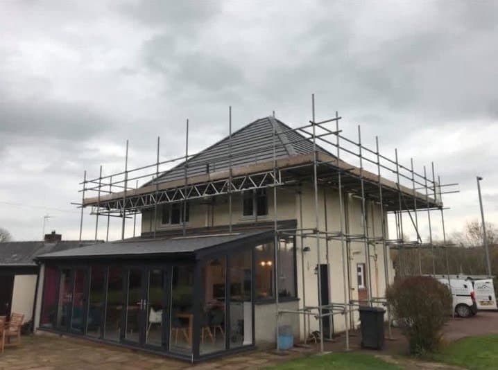 House scaffolded for a re-roof by RML Roofing Services
